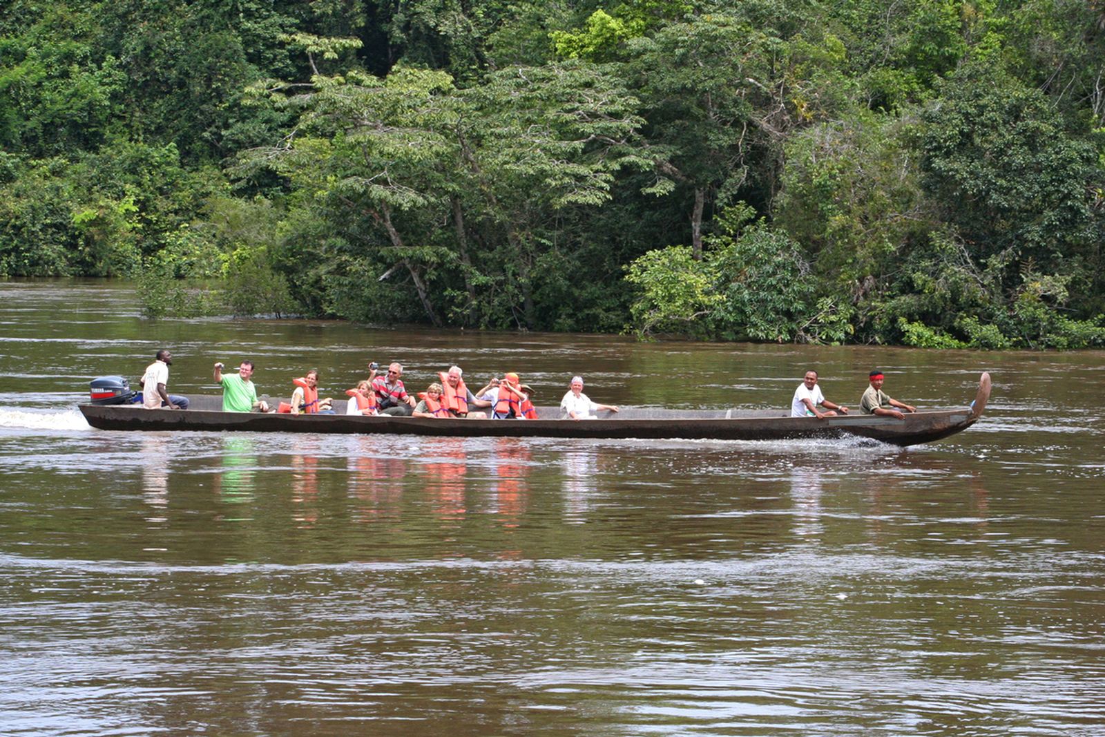 River travel by canoe — how supplies reach interior communities.